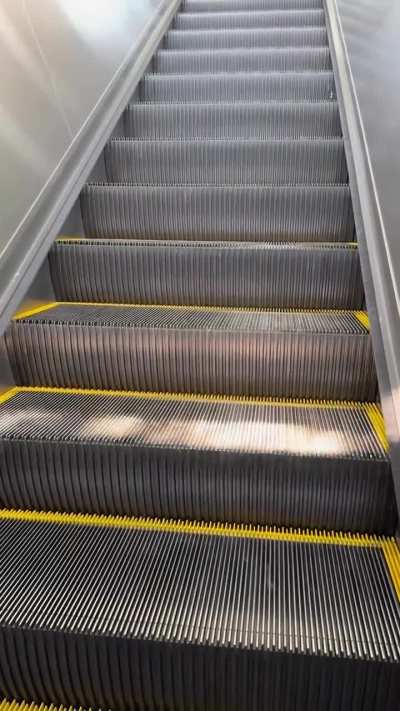 Sunlight falling down the escalator 
