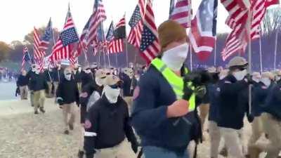 MAGA Nazis marching through Washington DC with signs that say 