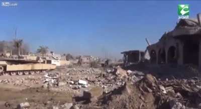 An Iraqi M1A1 Abrams tank neutralizes a VBIED with a 120mm M830 HEAT-MP-T in Mosul, Iraq