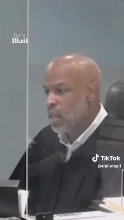 Police officer appears in court without pants.