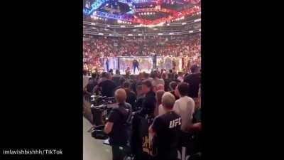 Girl gets LAUNCHED from Octagon after trying to storm the cage.Lmao.