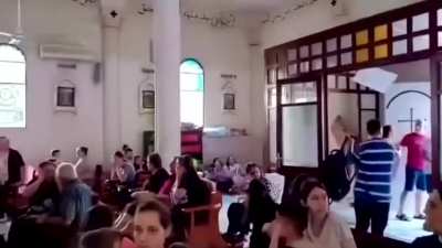 Praying in a church to the sound of air strikes