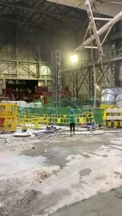 Another view of the excavator dropping into the shaft (2020-10-14)