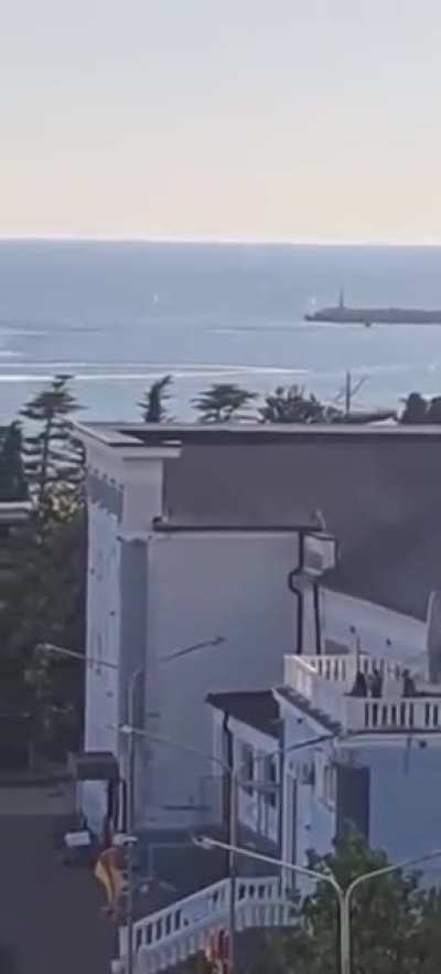 Another angle of the Ukrainian naval drone's attack on the Russian port of Tuapse, civilians standing on the coast and filming, September 24, 2025