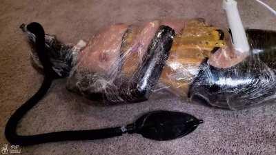 Rubberdoll mummified in tight plastic is forced to cum multiple times on a magic wand