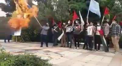 to light a flag on fire