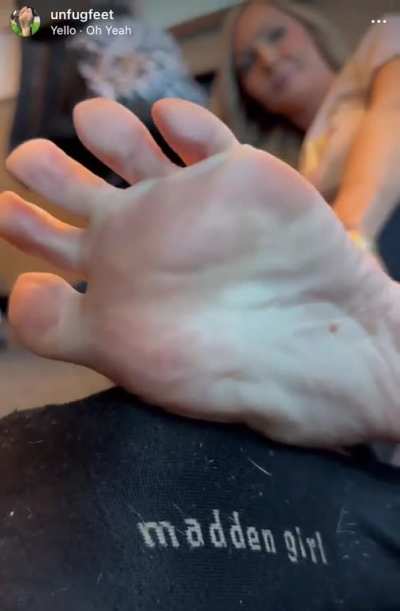 Kyle taking off her socks