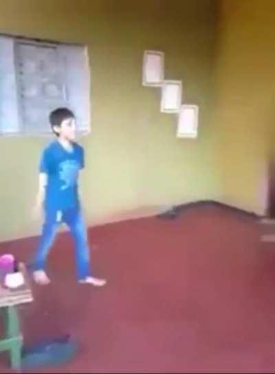 Kid wall kicks another kid