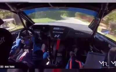 Idiot driving the wrong way up a rally stage