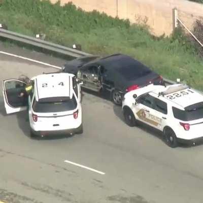 Trying to squeeze past a truck while being chased by the cops