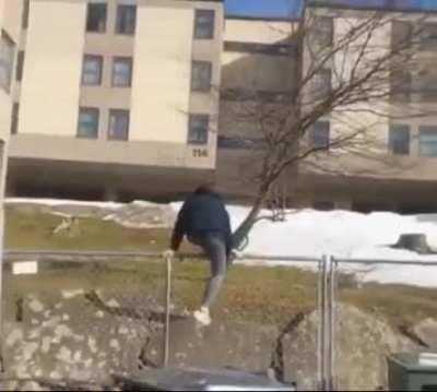 climbing an iron fence