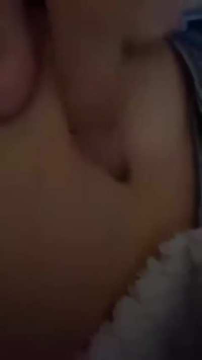 girl playing with her navel