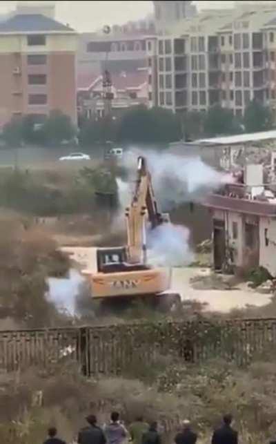 If You think a bulldozer would win against a man… think again