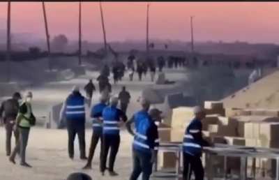 Moments before the most recent massacre in Gaza - An American voice is heard saying, “Here they come,” in a chilling, sadistic tone, as hundreds of starving civilians in Gaza run toward limited aid.