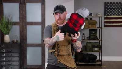 A tactical baby carrier. Because of course that's a thing.