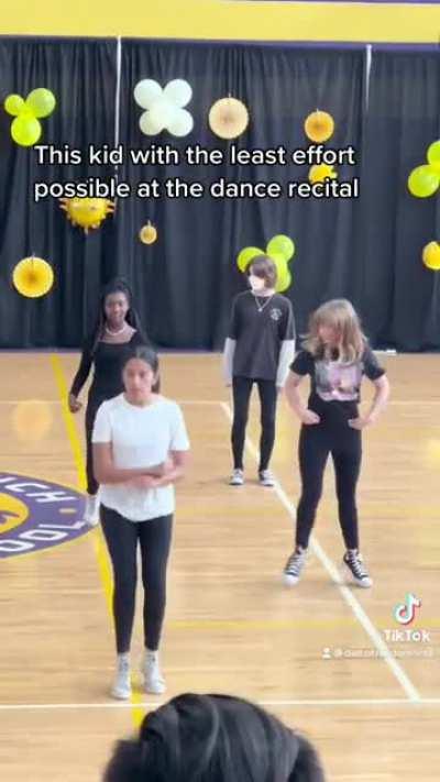 This kid can’t be less excited to be there