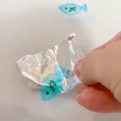 What happens when you draw a picture on a piece of tin foil using whiteboard markers, and immerse it in water