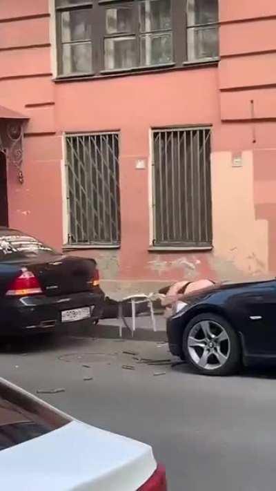 Man and woman fall off a balcony