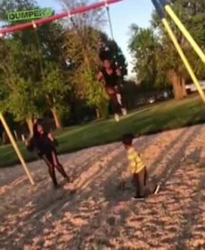 The camera man(camera person?) and lady on the left swing were both not doing anything