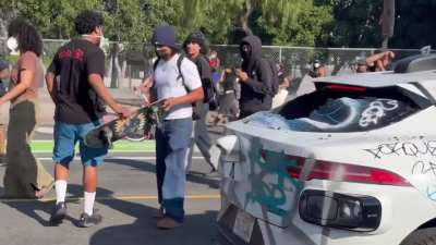 A WayMo has just been set on fire by protestors and multiple other around have also been destroyed.