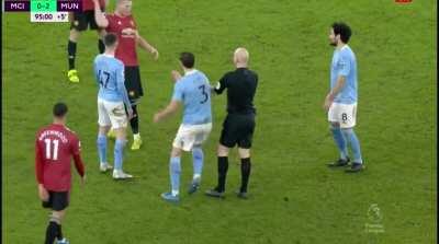 McTominay kicks ball into Anthony Taylor's head.