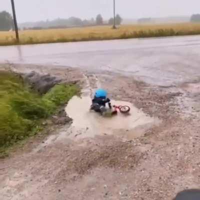 Kid tries to cross puddle and discovers futility of life