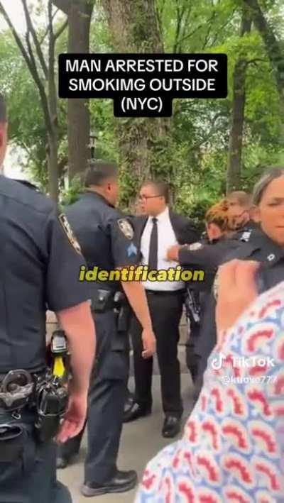 Man arrested for smoking outside after he refused to show his ID.