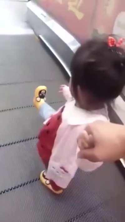 Textbook travelator exit.