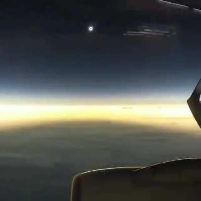 Taking the right flight at the right time and experiencing an eclipse