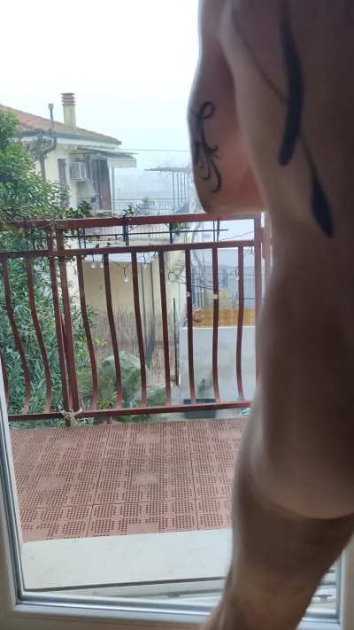 As requested, kneeling naked on the balcony, with cage and collar