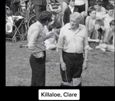 This is the most irish thing ever.. a man teaching a child to swim using a rope with no ability to swim himself.