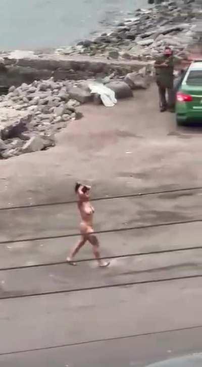 Police training to stop naked dancer at the beach. Even a sea lion was watching it.