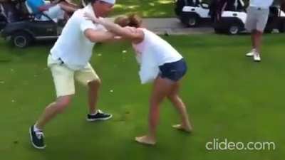 Male golfer vs female wrestler, the first person to land a takedown win - he tried once every year for 3 years