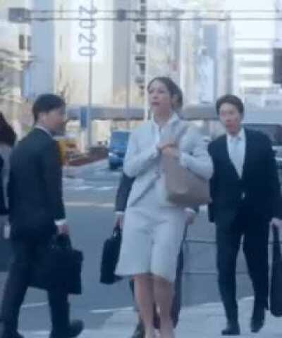 Woman faints on a sidewalk