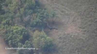 ua pov An American-made M30A1 rocket hits a Russian Howitzer and supporting artillery trucks.