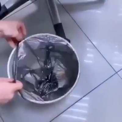 Keeping the bags in the bottom of the can to pull up the bag easily