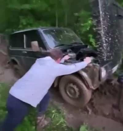 Helping with the car in the mud