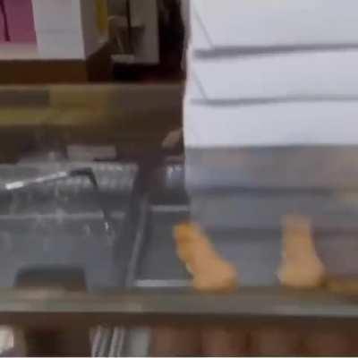Customers buy out all of the donuts at a shop so that owner can go home and spend time with his sick wife 