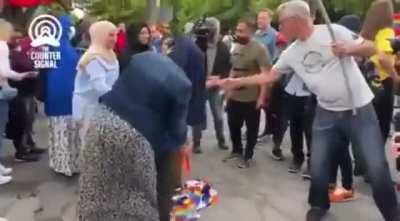 Mother tells her kid to stomp on pride flag in Ottawa