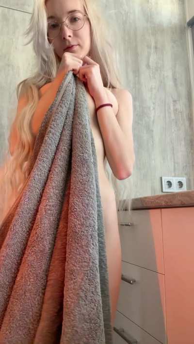 I'm totally turned on, clutching a towel over my tits, feeling super sexy