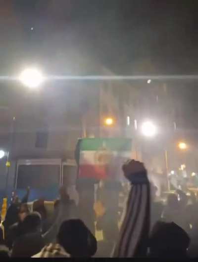 The people in Iran are literally holding the monarchy flag with Reza Pahlavi’s face printed on it while chanting “Pahlavi will return”