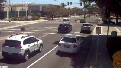 A group of distracted drivers run a red light