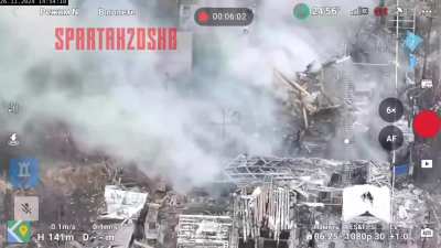 Two Russian soldiers crushed by collapsing wall of a building hit by a mortar round