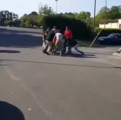 Guy fights a dozen skateboarders and loses