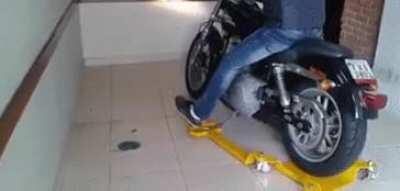 Motorcycle dolly for confined spaces.