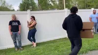 Peaceful protest in front of armed civilians