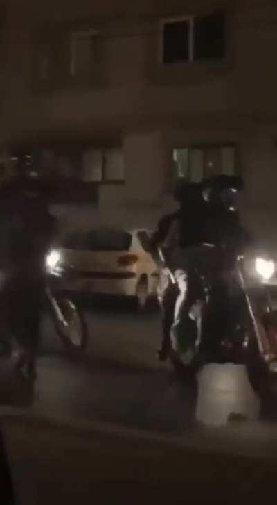 police officers dressed as civilians shoot camera woman