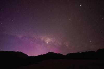 Went hiking in the mountains near Arthur's Pass, New Zealand - I set up for a timelapse in this dark sky area only to be surprised by an Aurora Australis shining to the south