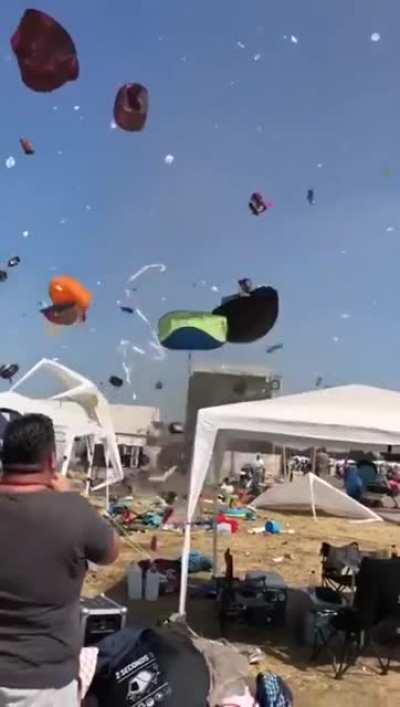 Dust devil causes problems for tourists.