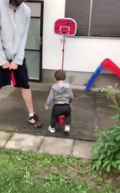 18 month old scores his first basket with his family as his teammates